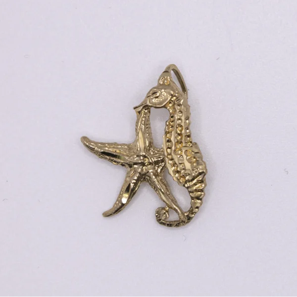 Dije en forma estrella y caballito de mar 14k