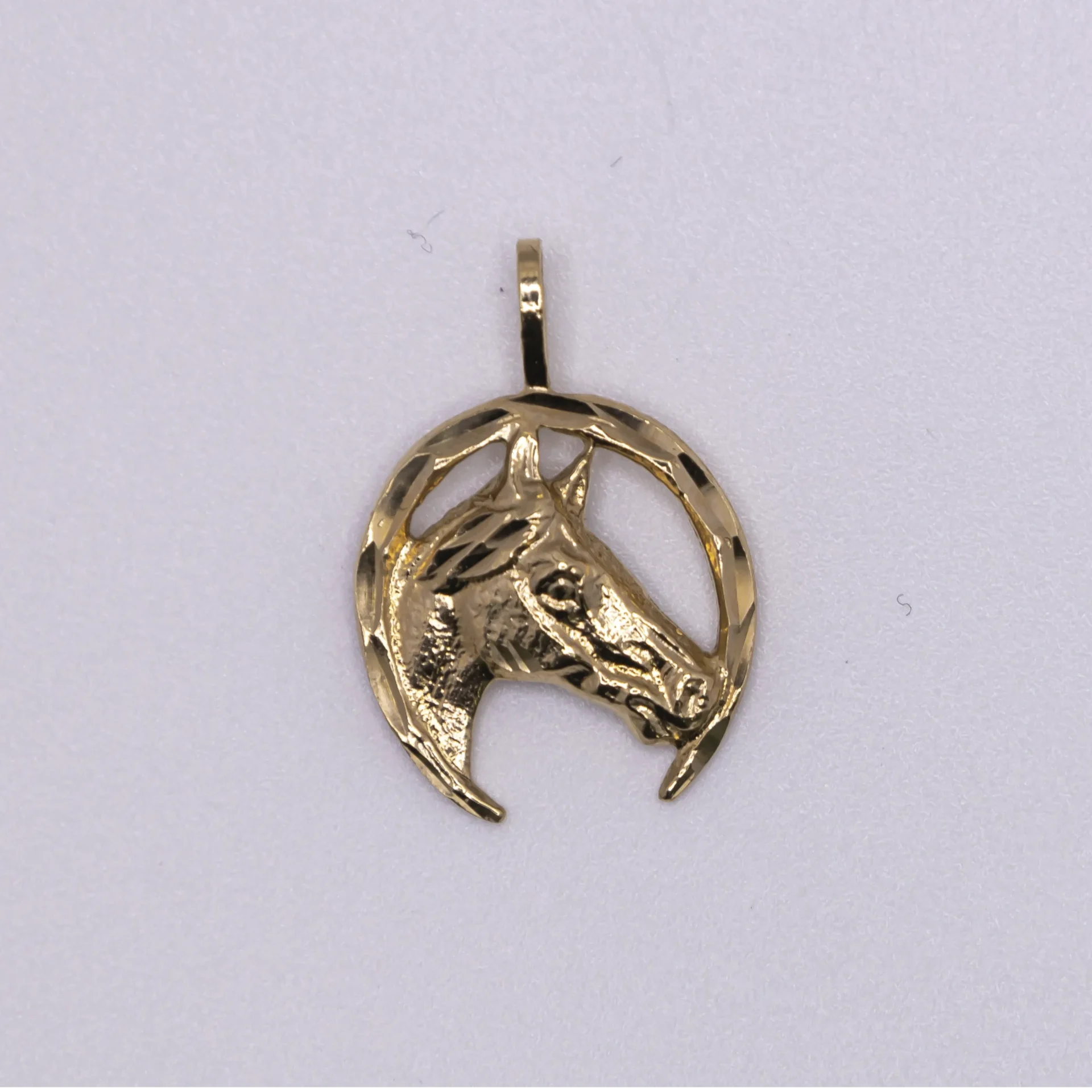Dije en forma herradura y caballo 14k